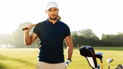 Handsome confident male golfer standing with golf club - polo Shirts - Workwear Toronto - WorkwearToronto.com